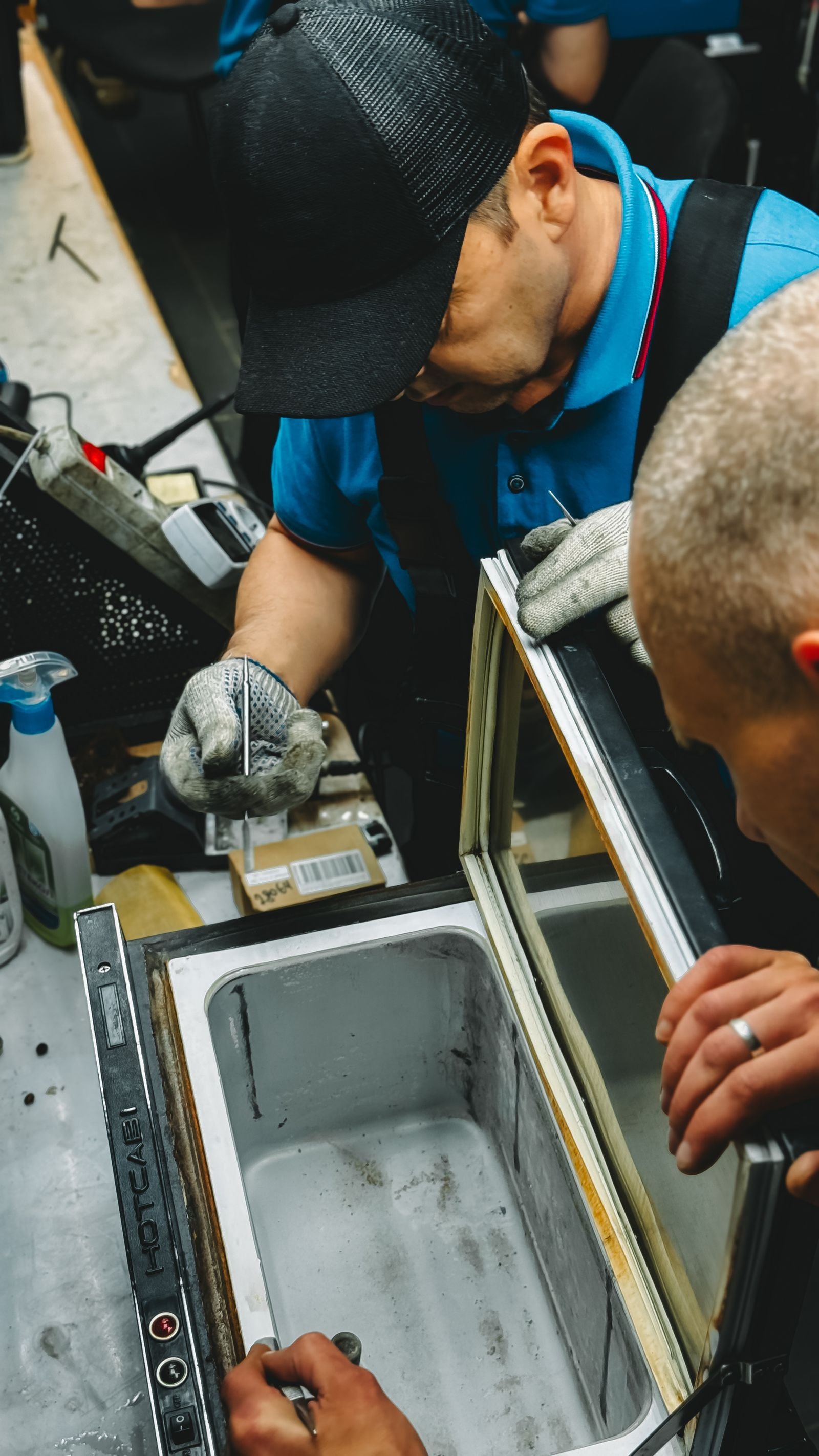 Technician repairing a household appliance